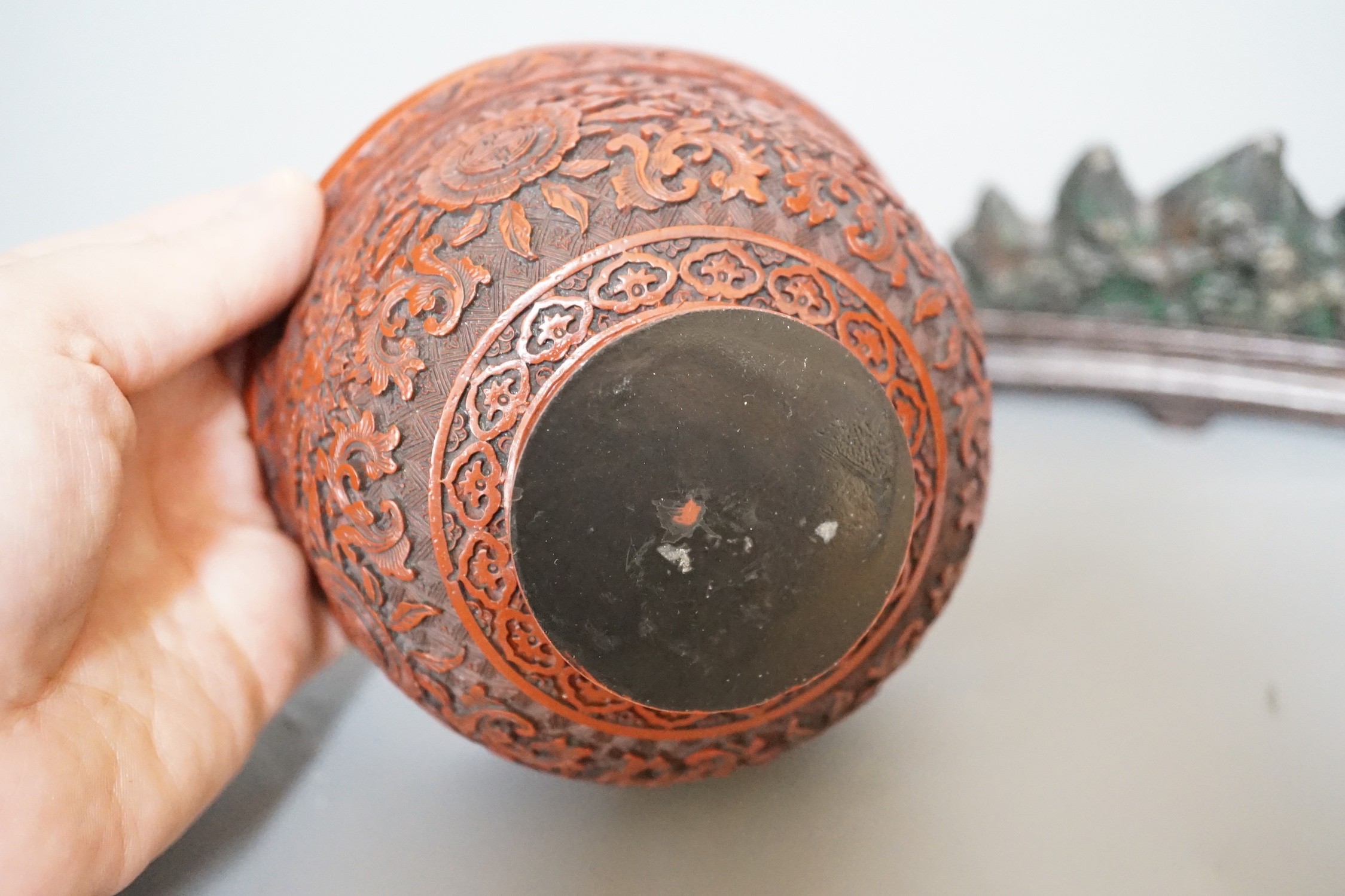 A Chinese painted metal brush rest on stand and a red lacquered bowl, 11cm